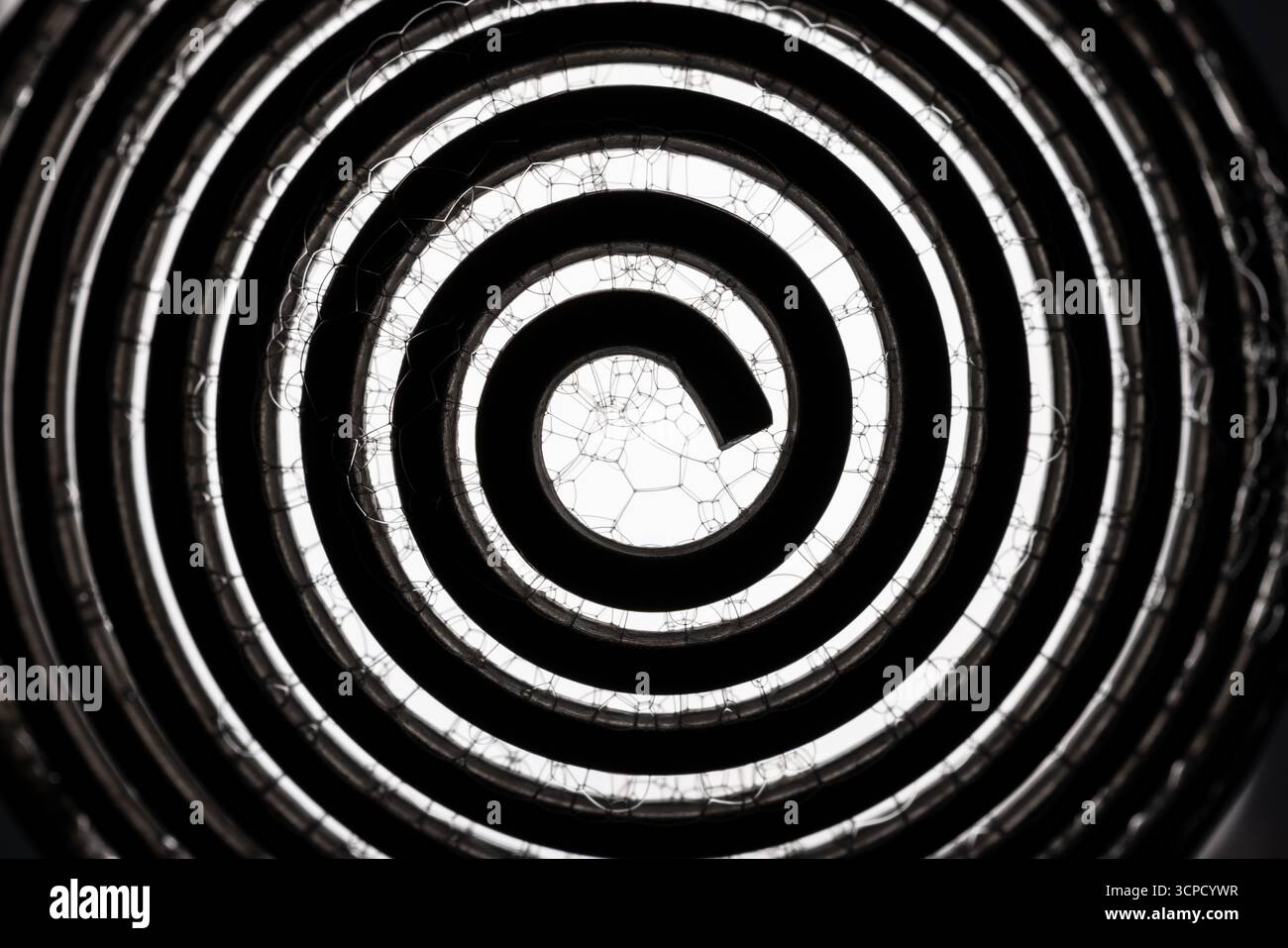 A metal spiral with soap bubbles abstract. Stock Photo