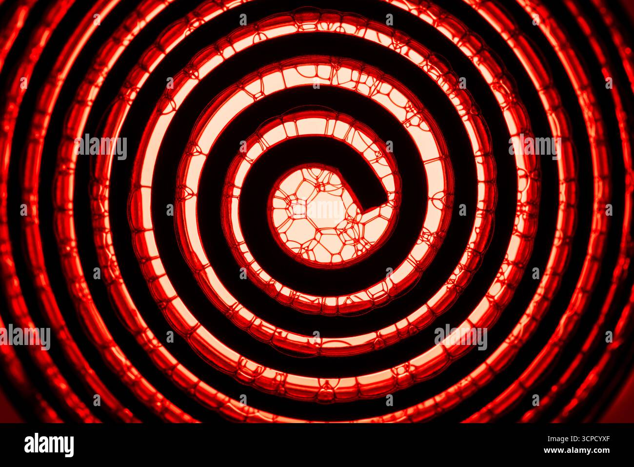 A metal spiral with soap bubbles abstract. Stock Photo