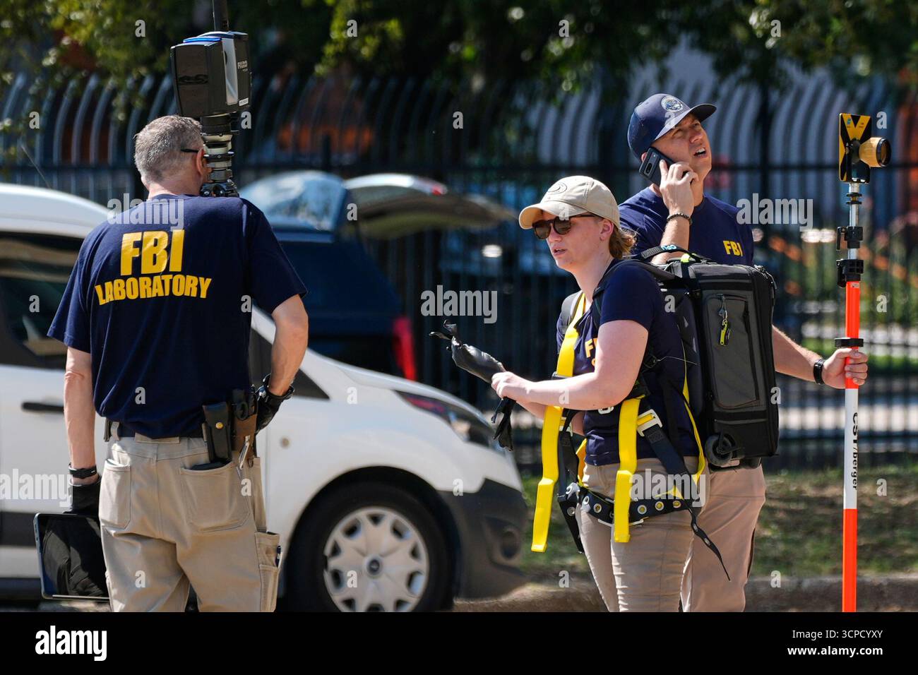 Fbi Customes FBI agents investigate the crime scene near a U.S. Immigration and ...