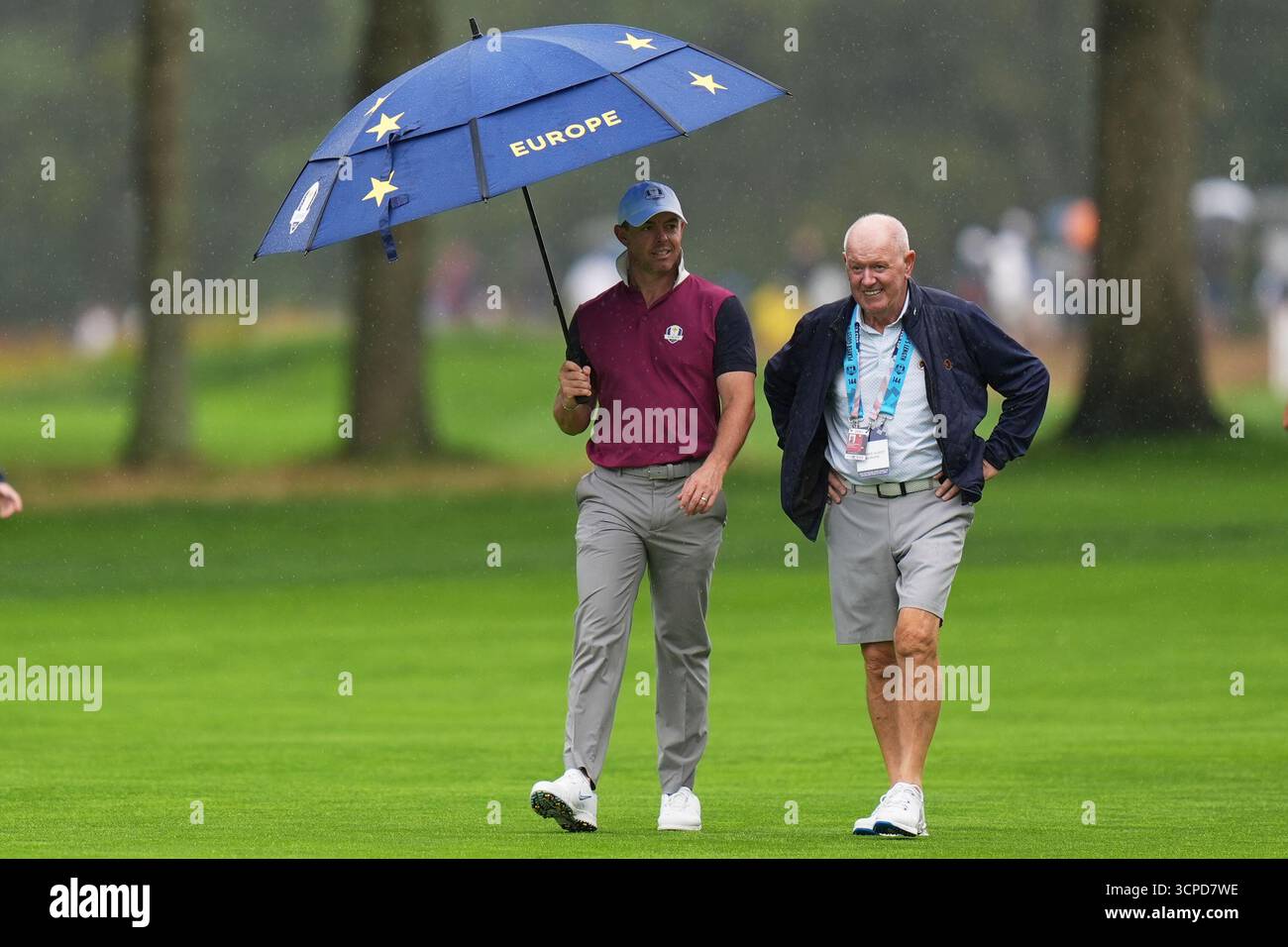 Europe's Rory McIlroy walks with his father Gerry on the eighth hole ...