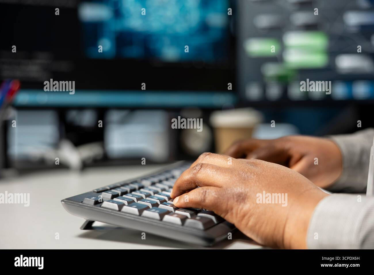 Close up of data center programmer typing on PC keyboard, using artificial intelligence neural networks. Server room expert typing code, using AI programming language on computer, configuring hardware Stock Photo