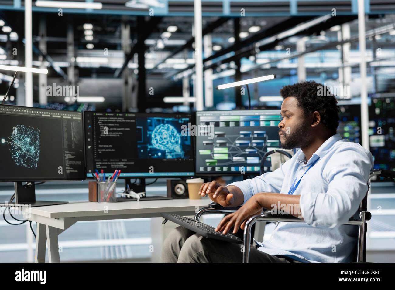 Data center engineer with disability in wheelchair using AI visualization tool. Worker with paraplegia in inclusive server farm workplace uses artificial intelligence analysis software Stock Photo