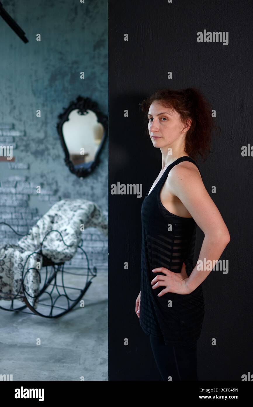 Woman in black top indoors hi-res stock photography and images - Alamy