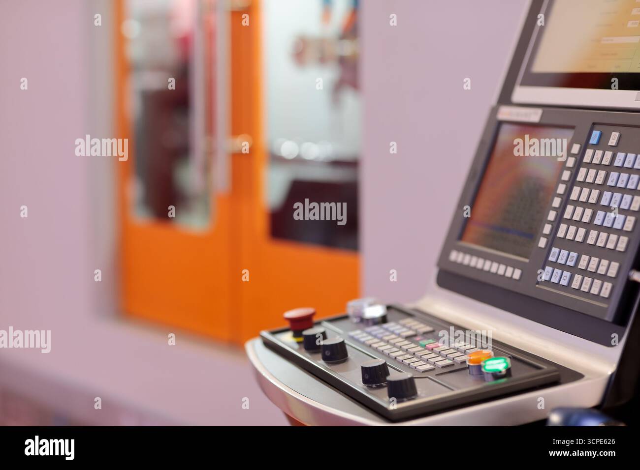 CNC control console of modern machining center. Selective focus. Stock Photo