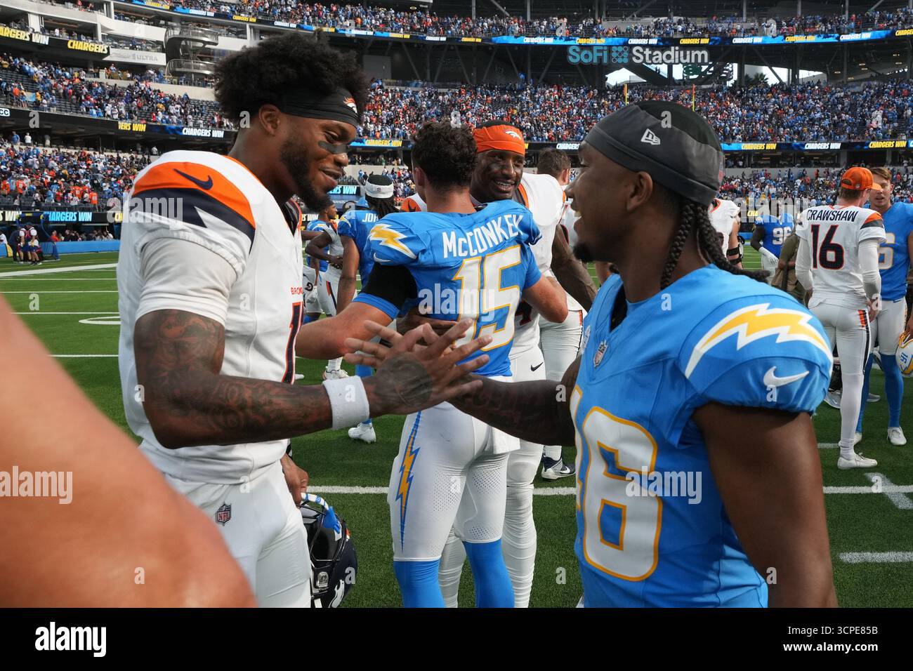Los Angeles Chargers cornerback Nikko Reed (46) greets Denver Broncos ...