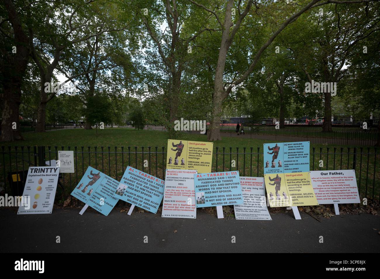 Religious debate placards at Speakers’ Corner, the public speaking north-east corner of Hyde Park, London, UK Stock Photo