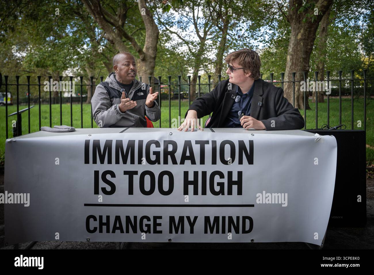 ‘Immigration is Too High’ debate between a working UK based migrant(L) and anti-immigration activist Young Bob(R) at Speakers’ Corner, London, UK Stock Photo