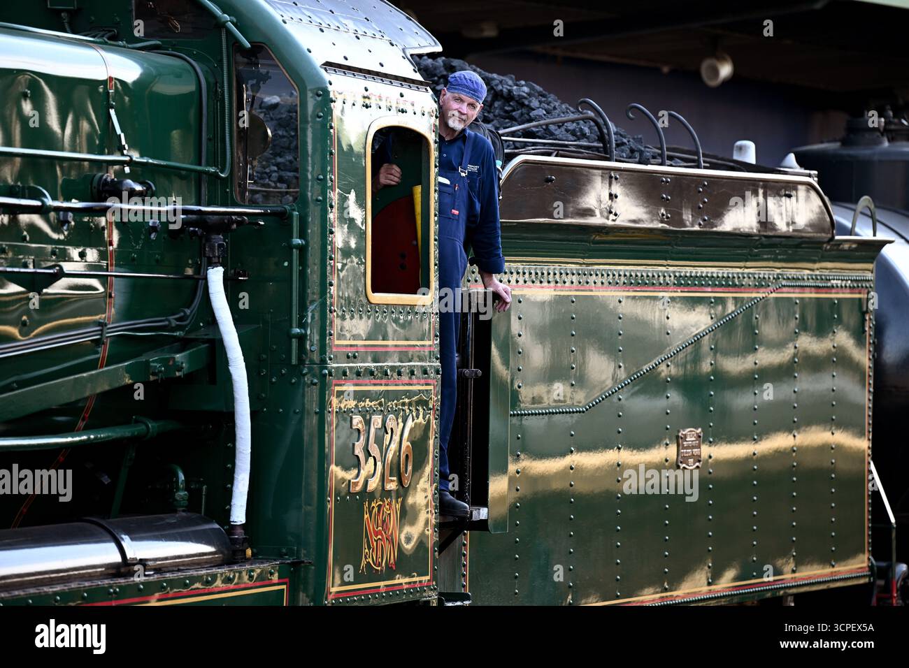 Driver Alex Claassens poses for a photograph as he prepares the 3526 ...