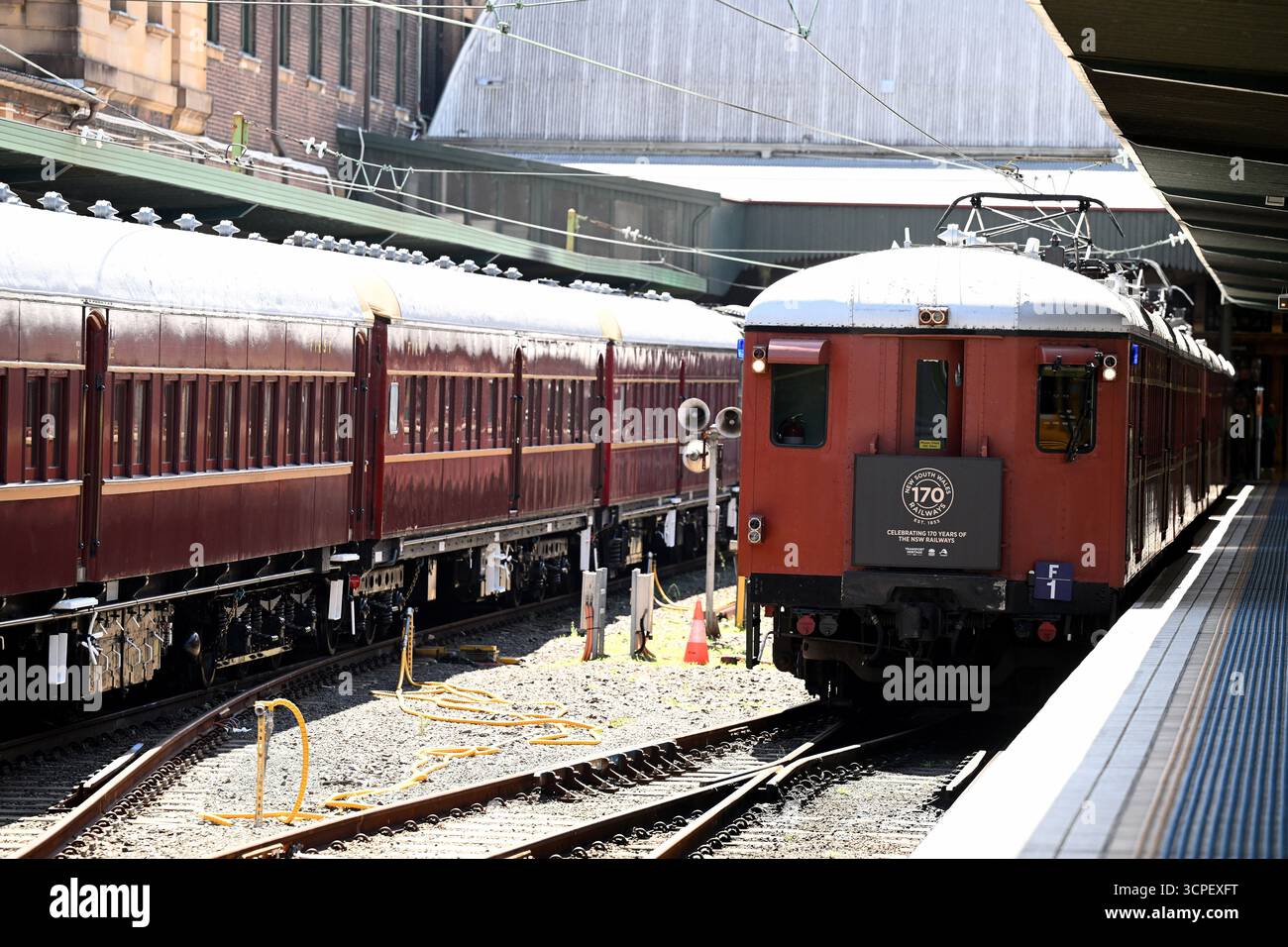 Red Rattler Train Inside A ‘red rattler’ train is seen next to the carriages of the 3526 steam ...