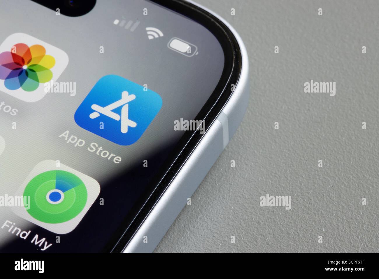 Apple's App Store icon is seen on the screen of an iPhone. The App Store is an app marketplace developed and operate by Apple. Stock Photo