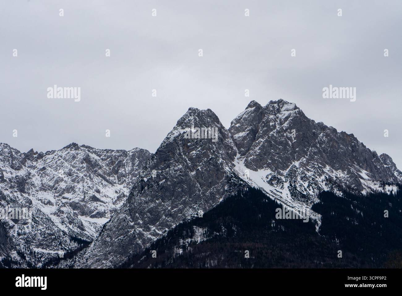 snowy mountain peaks of the Zugspitze in the Alps Stock Photo