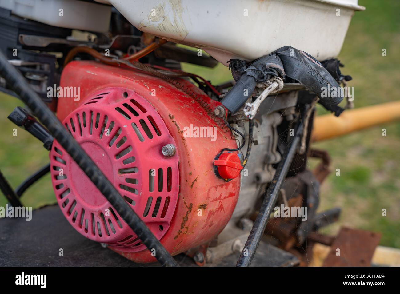 Old dirty rusty generator engine with cooling fan and mechanical parts ...