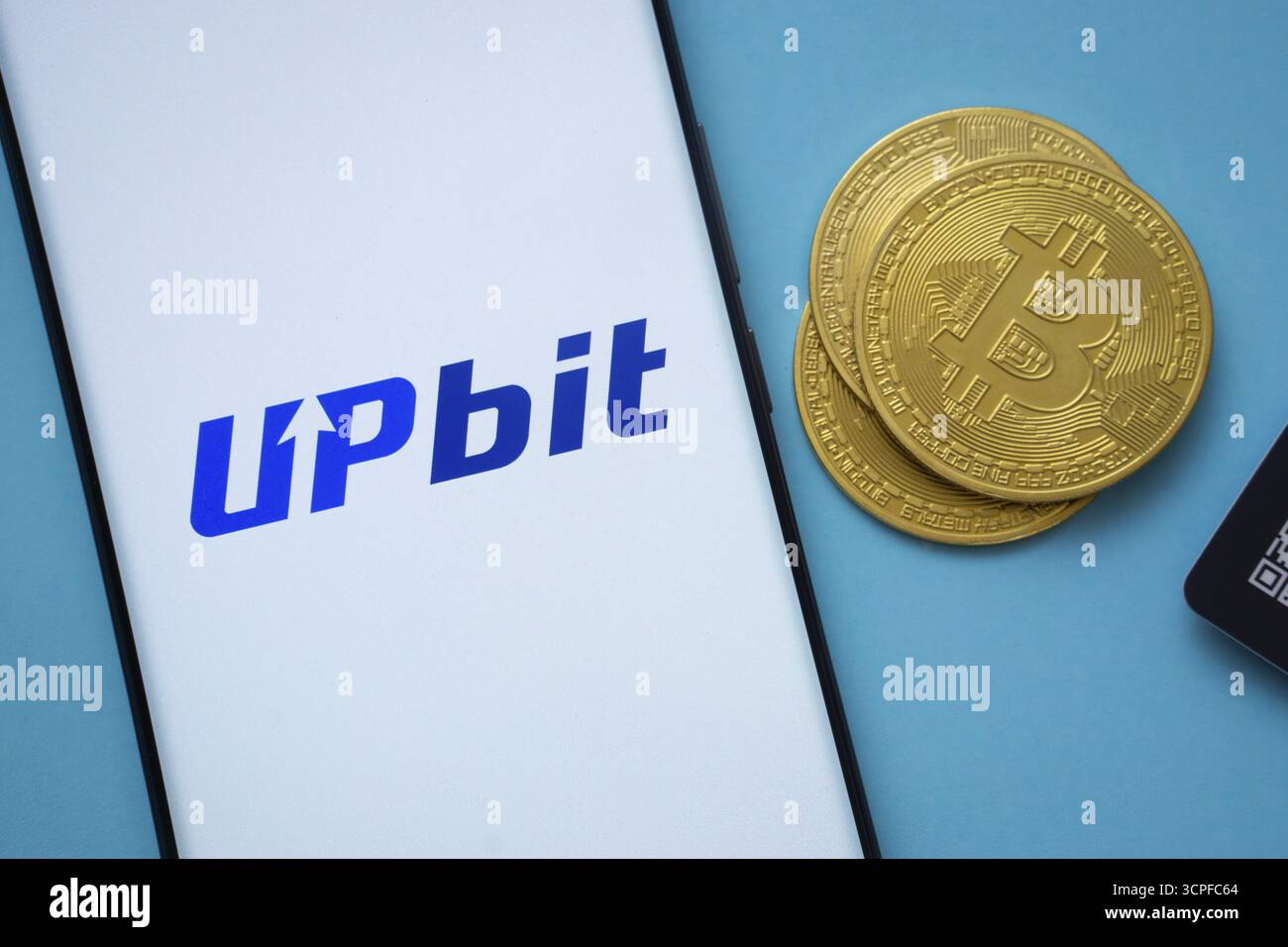 Upbit logo on smartphone screen against the background of the main  cryptocurrencies Stock Photo - Alamy