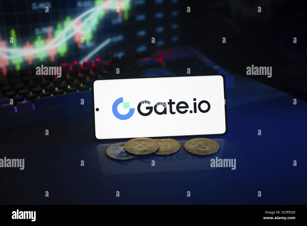 Gate.io logo on smartphone with coins, neon lights, and trading charts in  background Stock Photo - Alamy