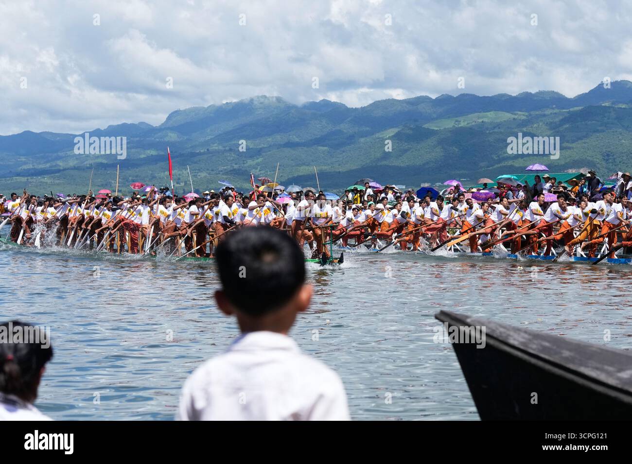 Intha ethnic people row their boats during a traditional boats racing ...