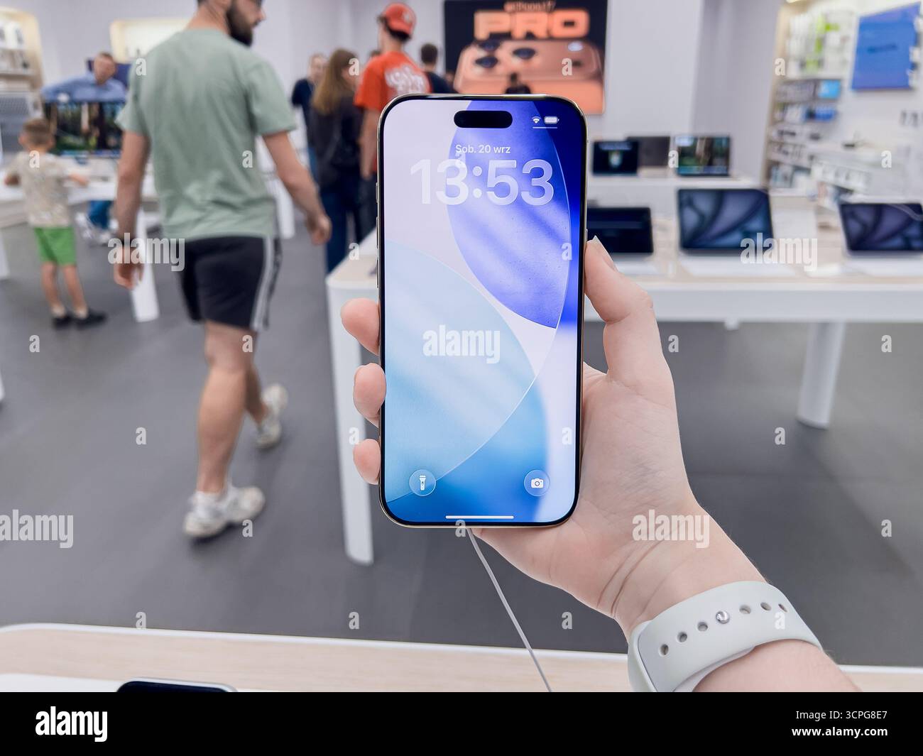 Poznan, Poland - September 20, 2025: iPhone Air device held by a user, demonstrating advanced features and user experience in a modern electronics sho Stock Photo