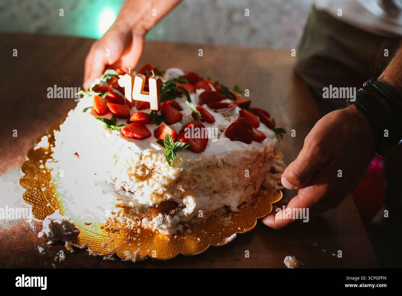 Hands in birthday cake hi-res stock photography and images - Alamy