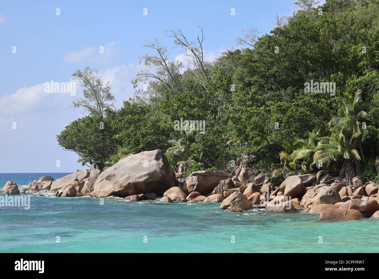 Beautiful beach of Petite Anse Kerlan with turquoise water, Praslin, Seychelles Stock Photo