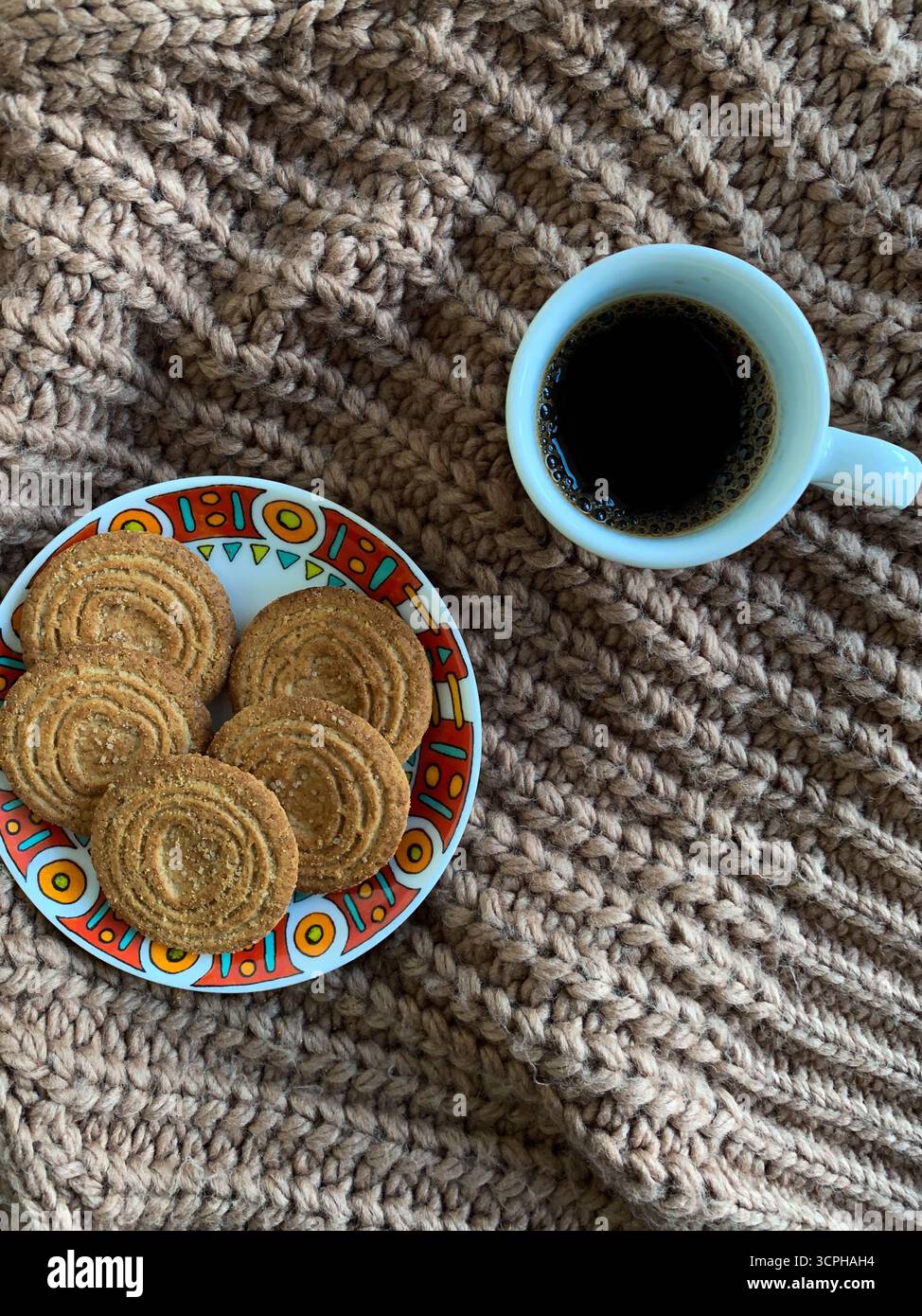A cup of coffee on autumn background. Brown sweater, coffee and biscuits. Autumn mood flat lay. Concept cozy coffee cup. Top view. Cozy autumn. - Smartphone Captured Stock Image
