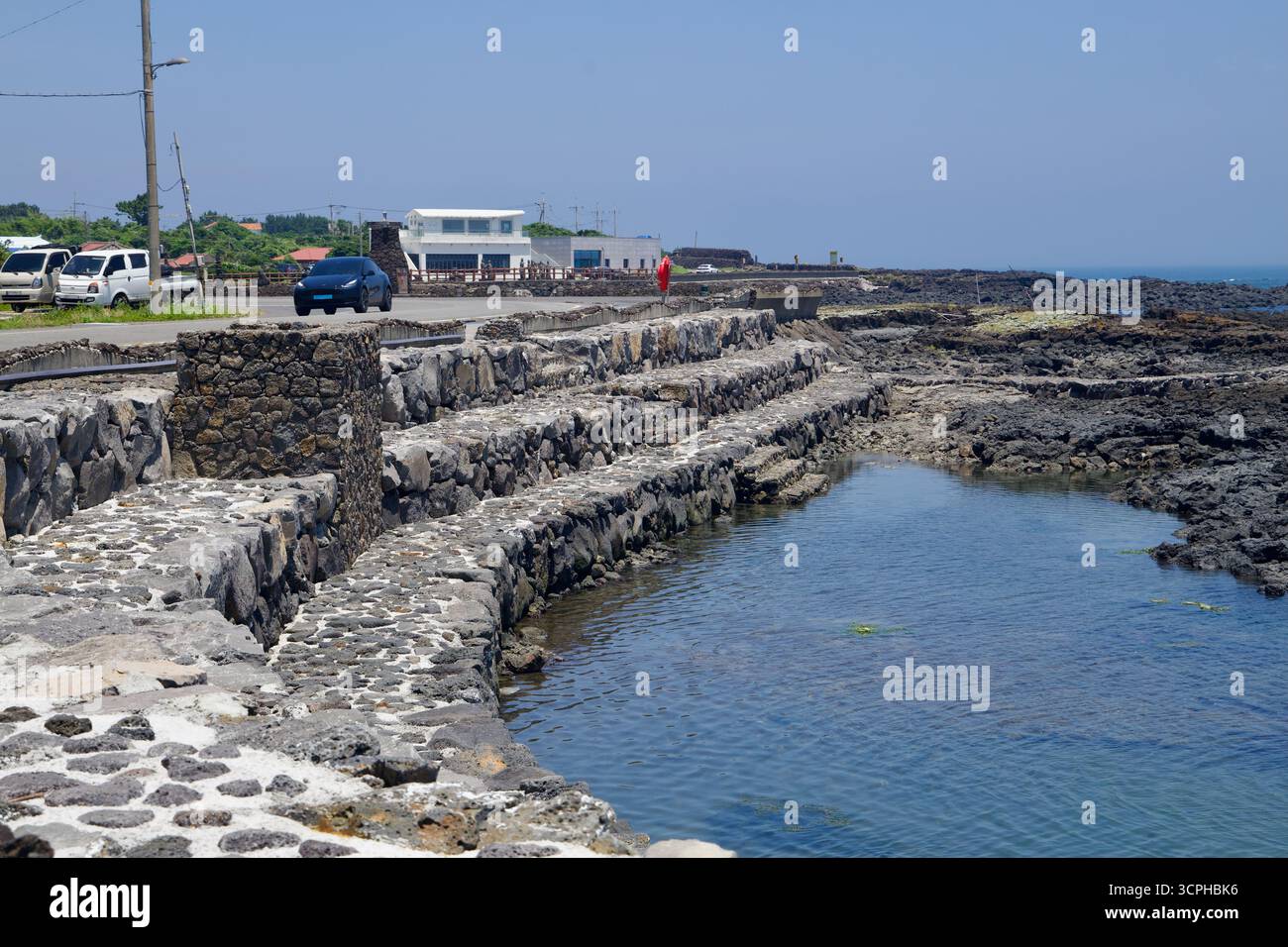 Stepped seawalls and narrow inlets form terraces along the Onpyeong ...