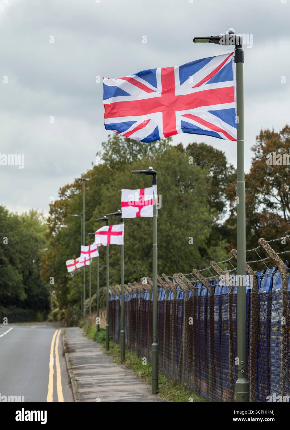 Union Jacks and St. George's Cross flags. Outside Biggin Hill Airport, London, UK. Stock Photo