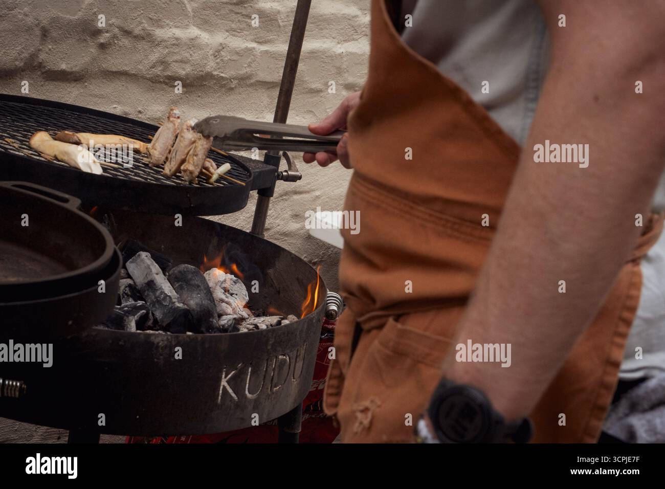 Chef Hunter Evans grills during the 