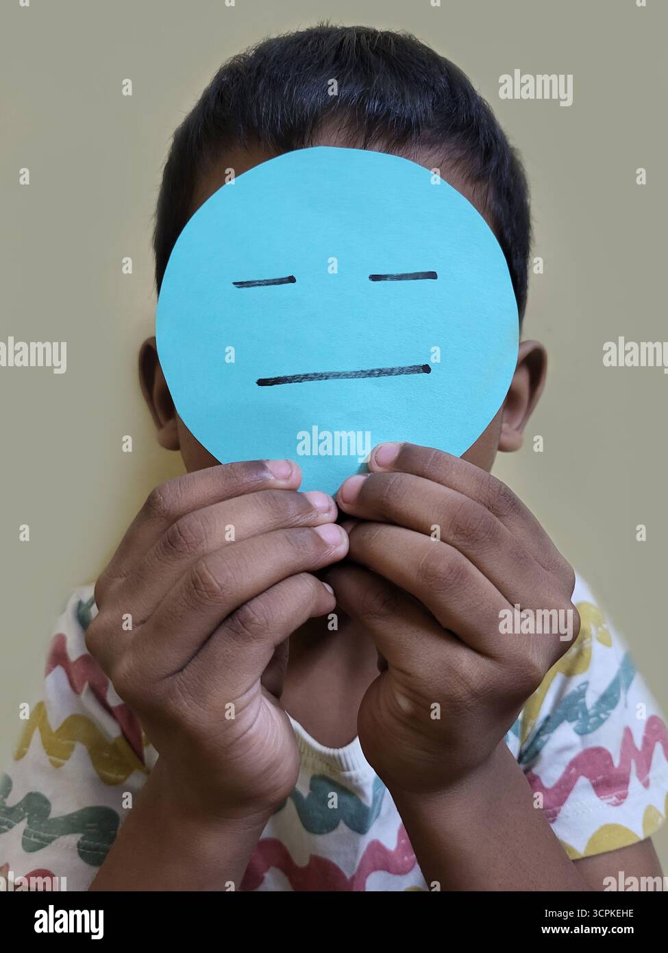 Child is Confused, holding cutout - Smartphone Captured Stock Image