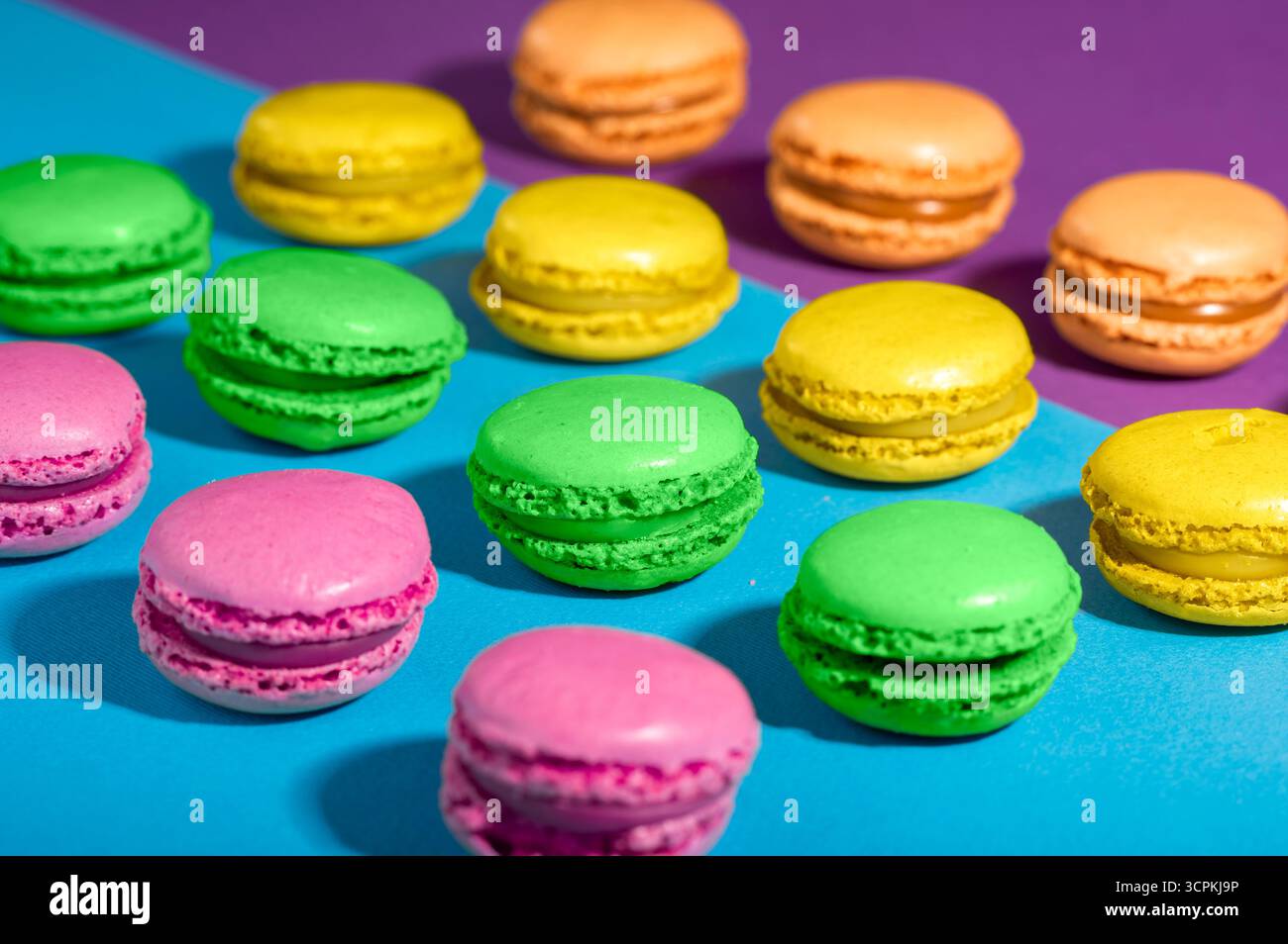 Colorful macarons  on a colorful background Stock Photo