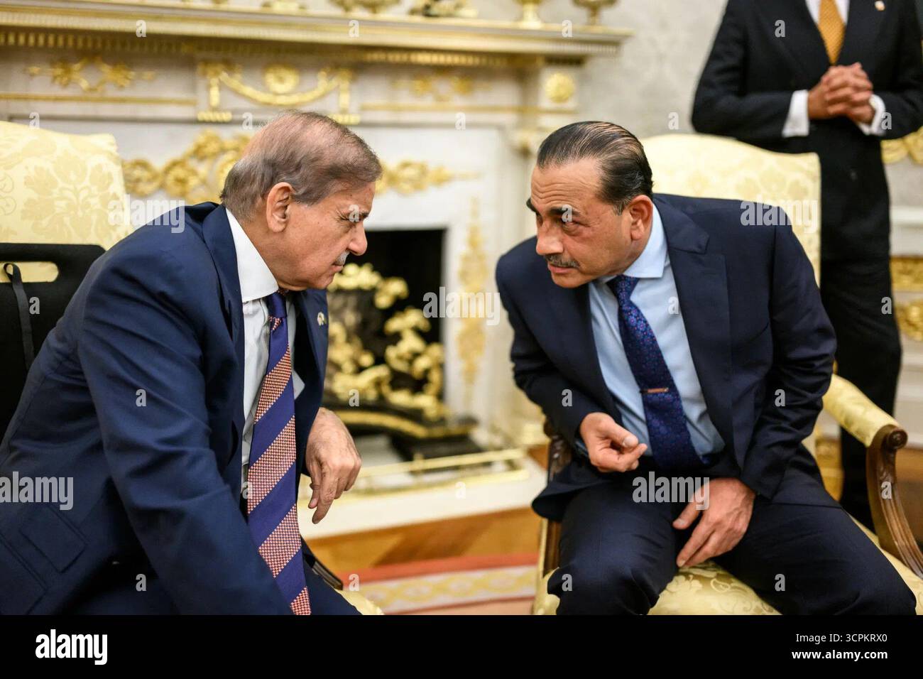 Prime Minister Shehbaz Sharif of Pakistan speaks with Field Marshal Asim Munir during a meeting at the White House in Washington, D.C. September 25, 2025. Image courtesy of the White House. Stock Photo