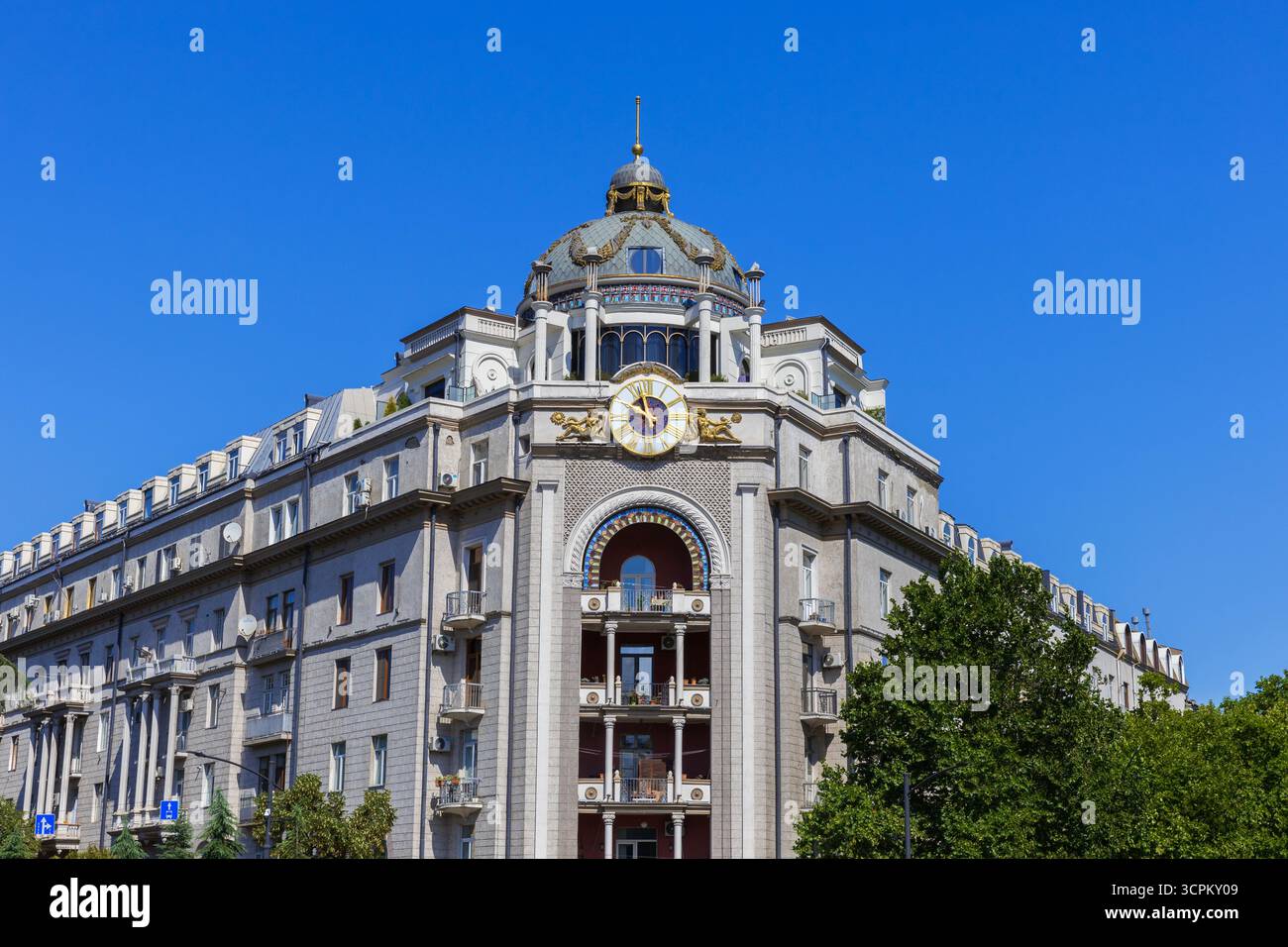The Clock Tower Building (late-19th - early-20 the century) at the end of the Nikoloz Baratashvili Bridge in Tibilisi, Georgia Stock Photo