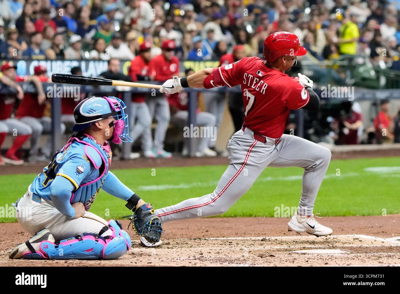 Cincinnati Reds' Spencer Steer hits an RBI single during the fourth