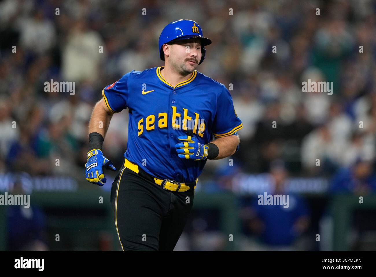 Seattle Mariners' Cal Raleigh runs after hitting a single during the ...