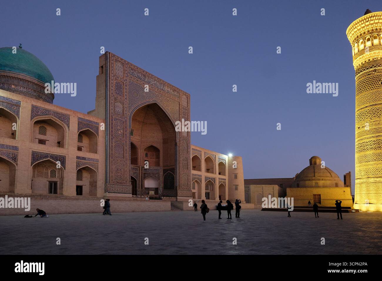 View of the illuminated Kalon Minaret built by the Karakhanid ruler ...