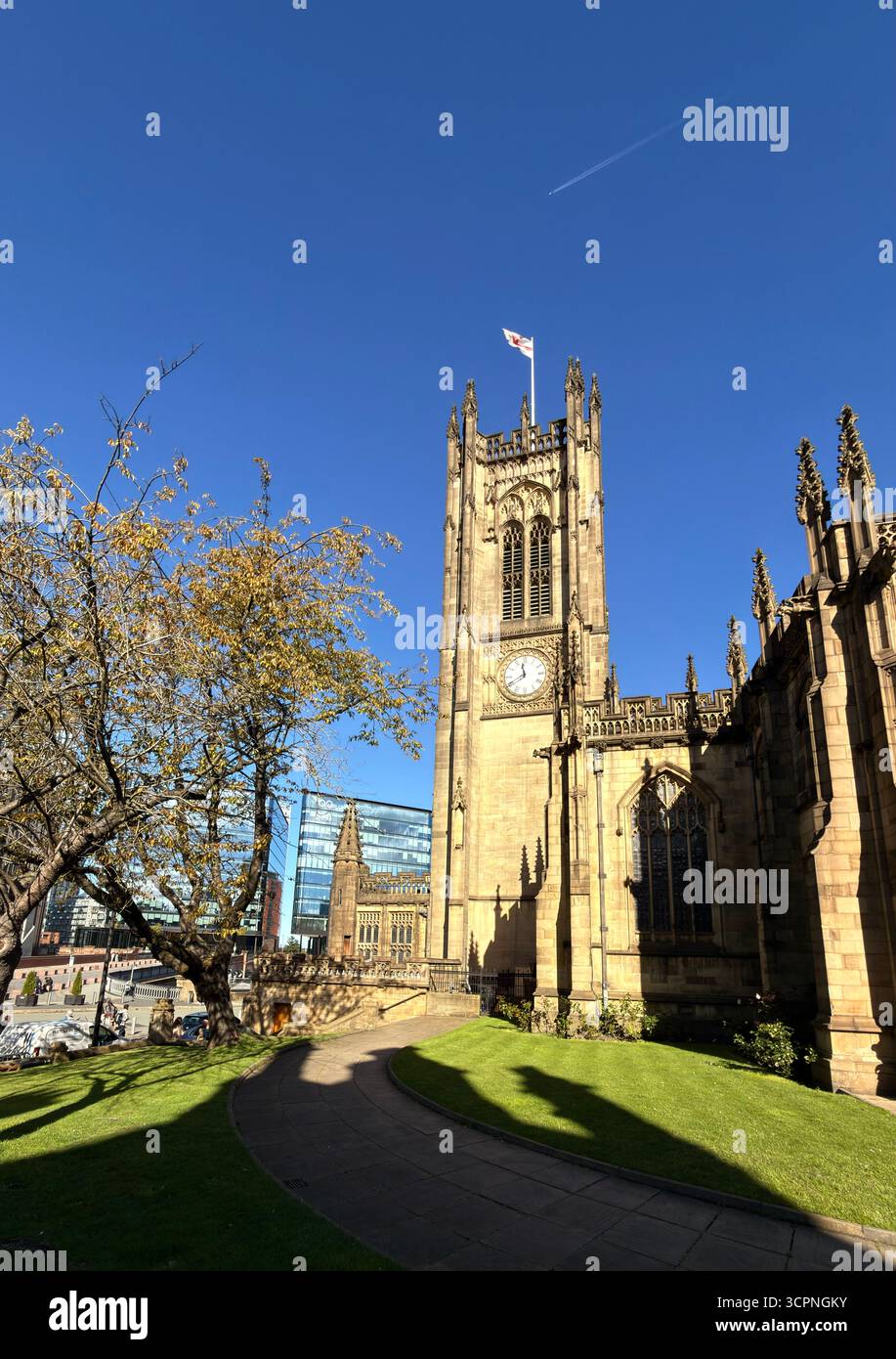 Manchester Cathedral clock tower and grounds in Manchester City centre - Smartphone Captured Stock Image