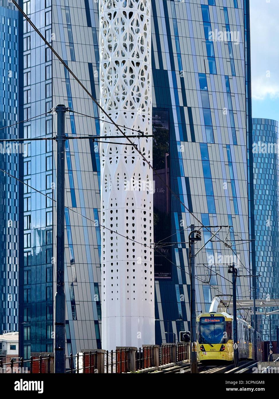 Yellow tram and skyscrapers of Deansgate Square complex in Manchester City centre - Smartphone Captured Stock Image