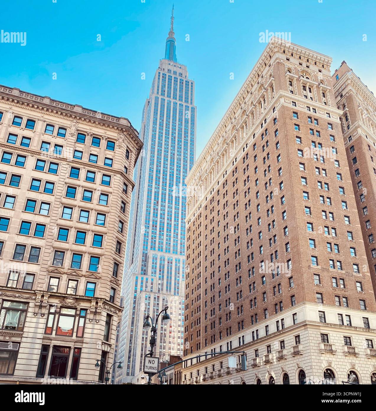 Empire State Building Surrounded by New York City Skyline on Clear Day - Smartphone Captured Stock Image