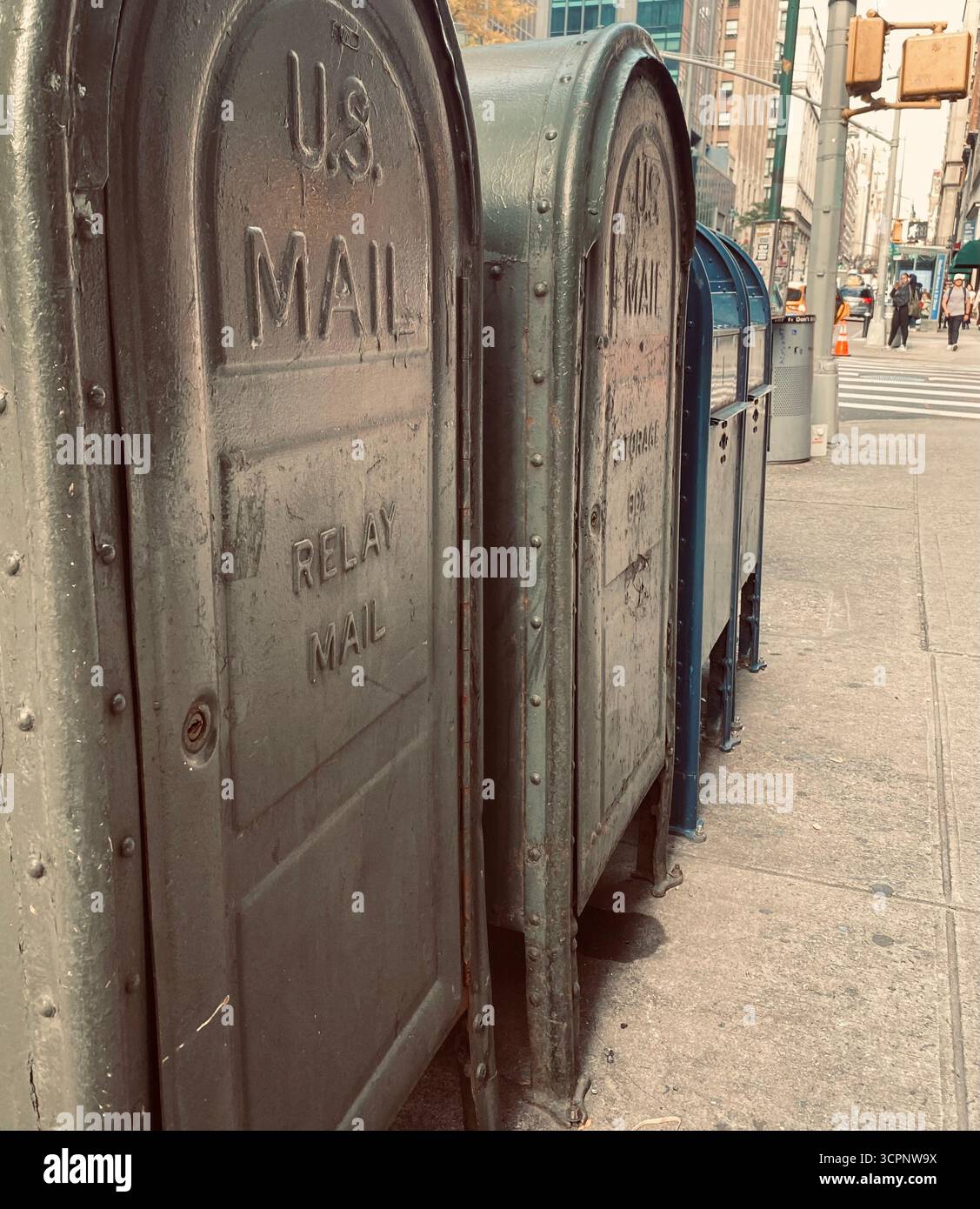Row of Urban Mailboxes on City Sidewalk - Smartphone Captured Stock Image