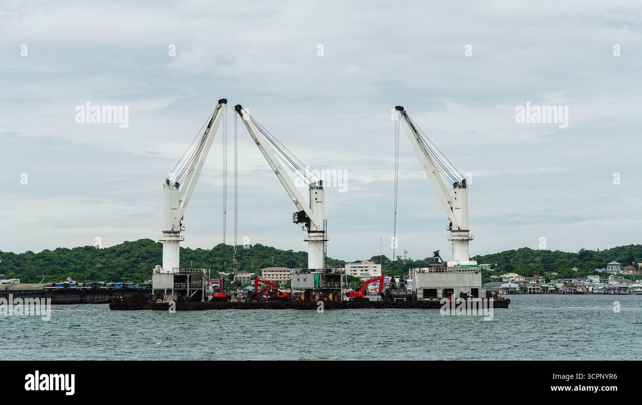 Industrial crane ship floating on sea port for cargo and marine ...