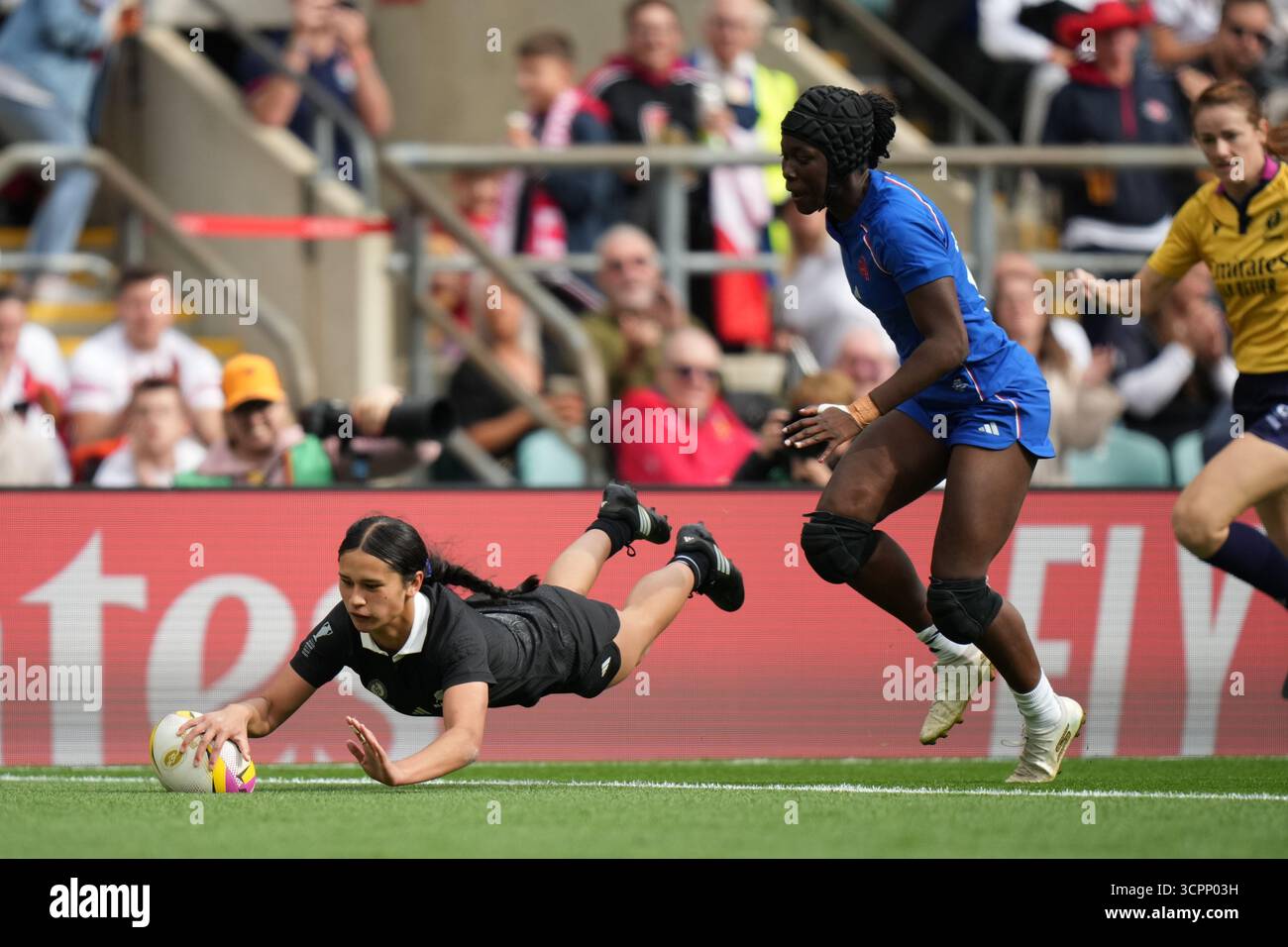 New Zealand's Braxton Sorensen-McGee, left, scores a try during the ...