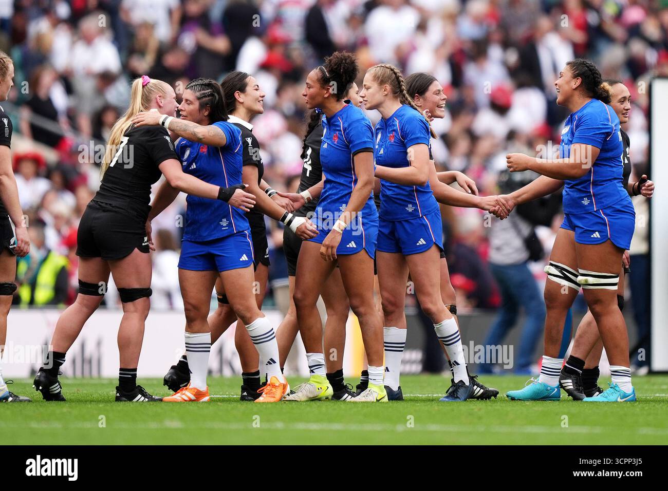 France and New Zealand players embrace after the Women's Rugby World ...
