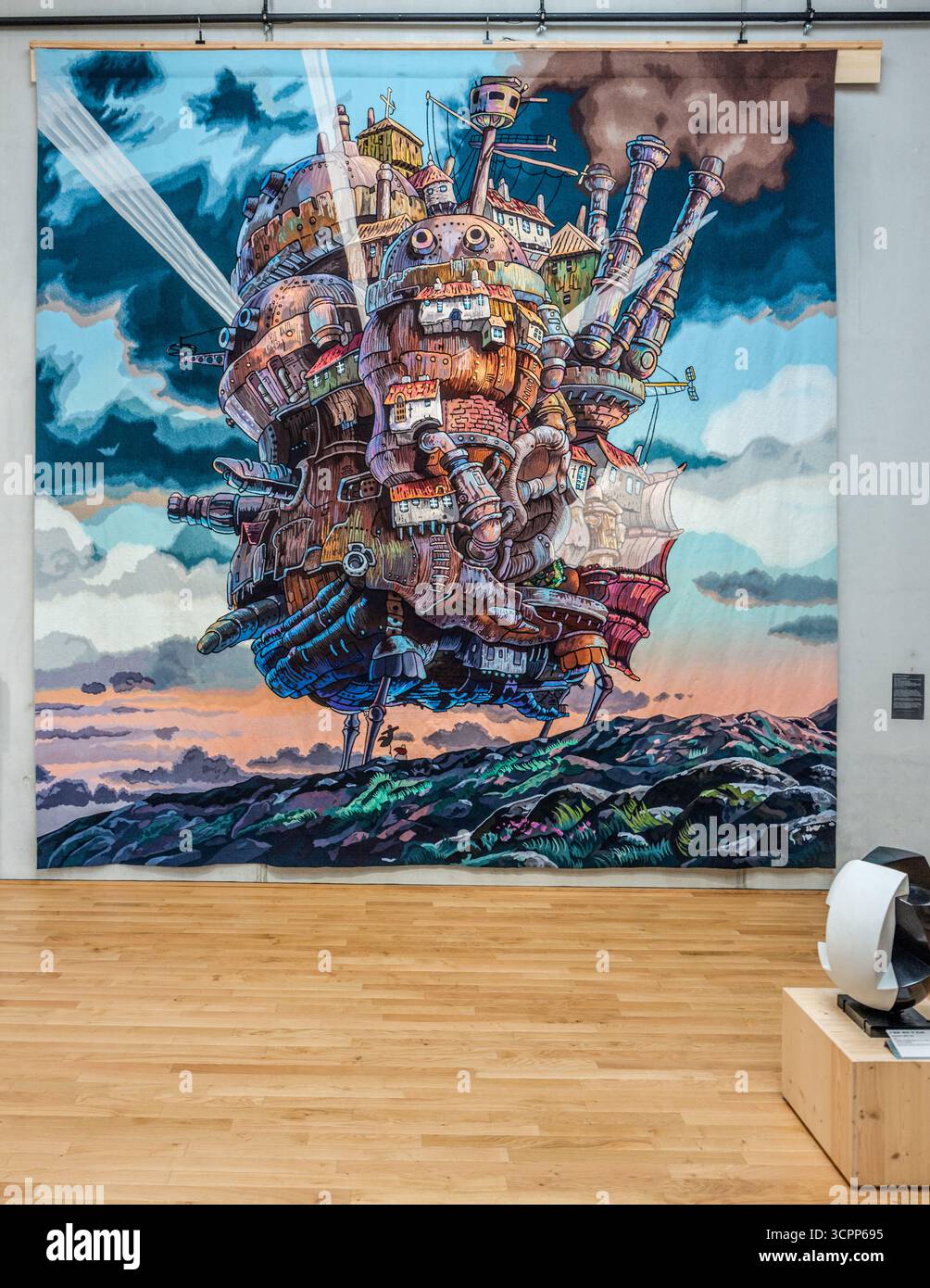 Woven adventures in the exhibition rooms of the Cité internationale de la tapisserie Aubusson. Here, "The moving castle at sunset" from the 2004 anime film Howl's Moving Castle. Woven in Aubusson from March 2022 to February 2023. Rue Williams Dumazet, Aubusson, Nouvelle-Aquitaine, France Stock Photo