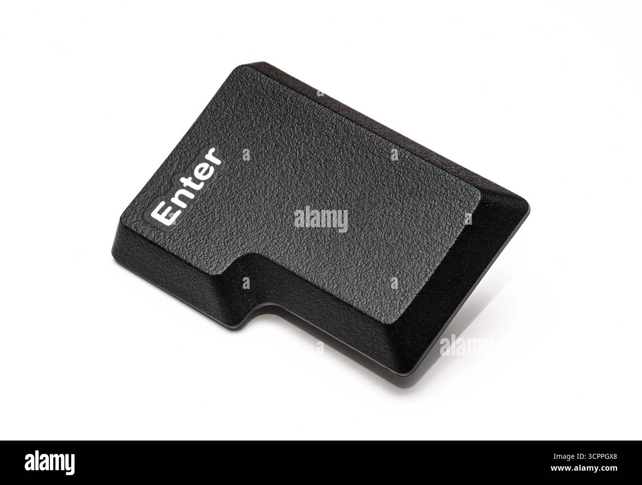 Enter key. Close-up image features a black enter keyboard key. Highlights the simplicity and functionality of computer peripherals. Stock Photo