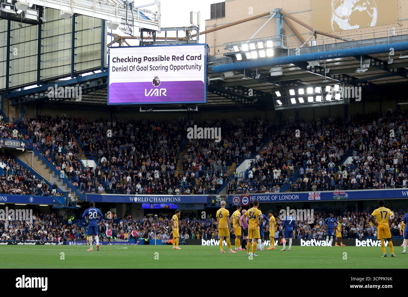 Players wait for a VAR decision on a red card incident during the ...