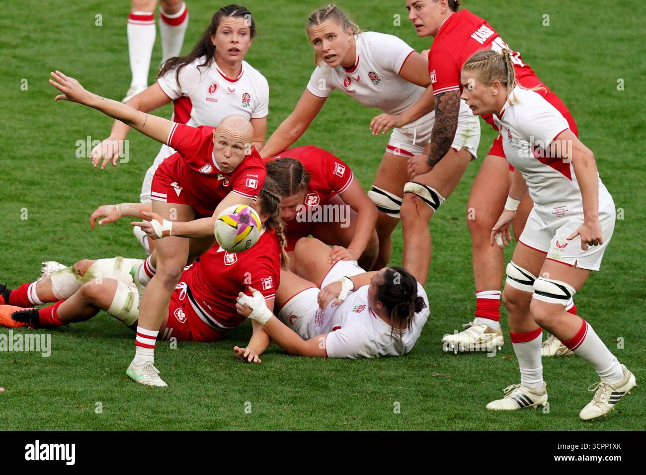Canada's Olivia Apps (left) passes the ball during the Women's Rugby ...