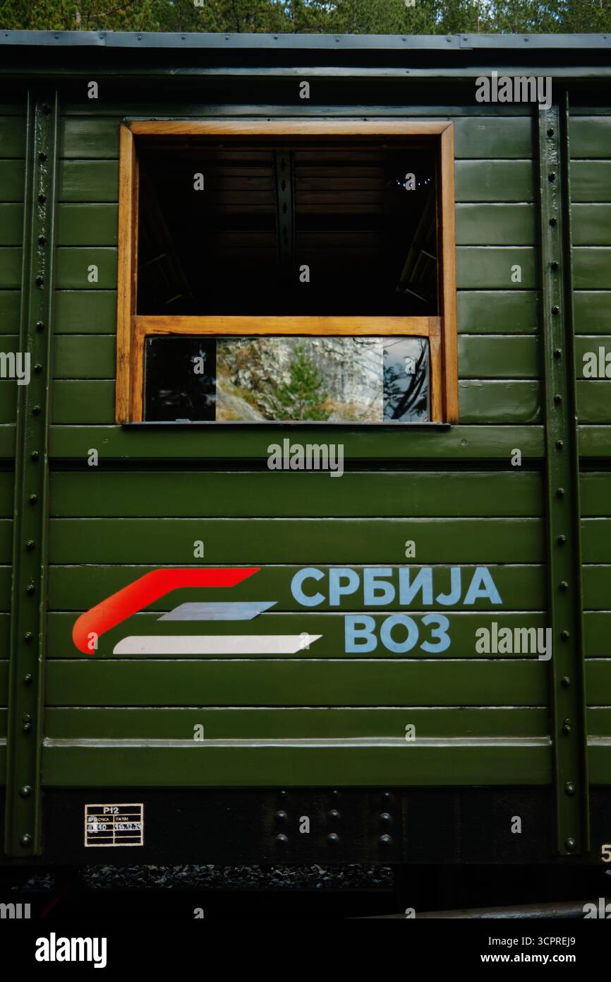 Open window and Srbija Voz logo on a green wooden carriage of the ...