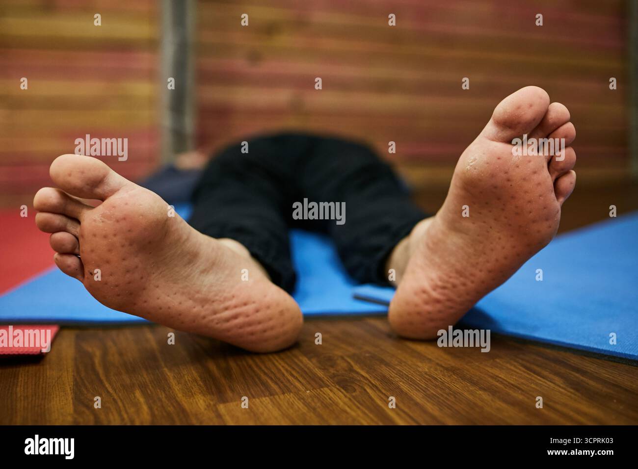 Feet of a man close-up after standing on nails Stock Photo
