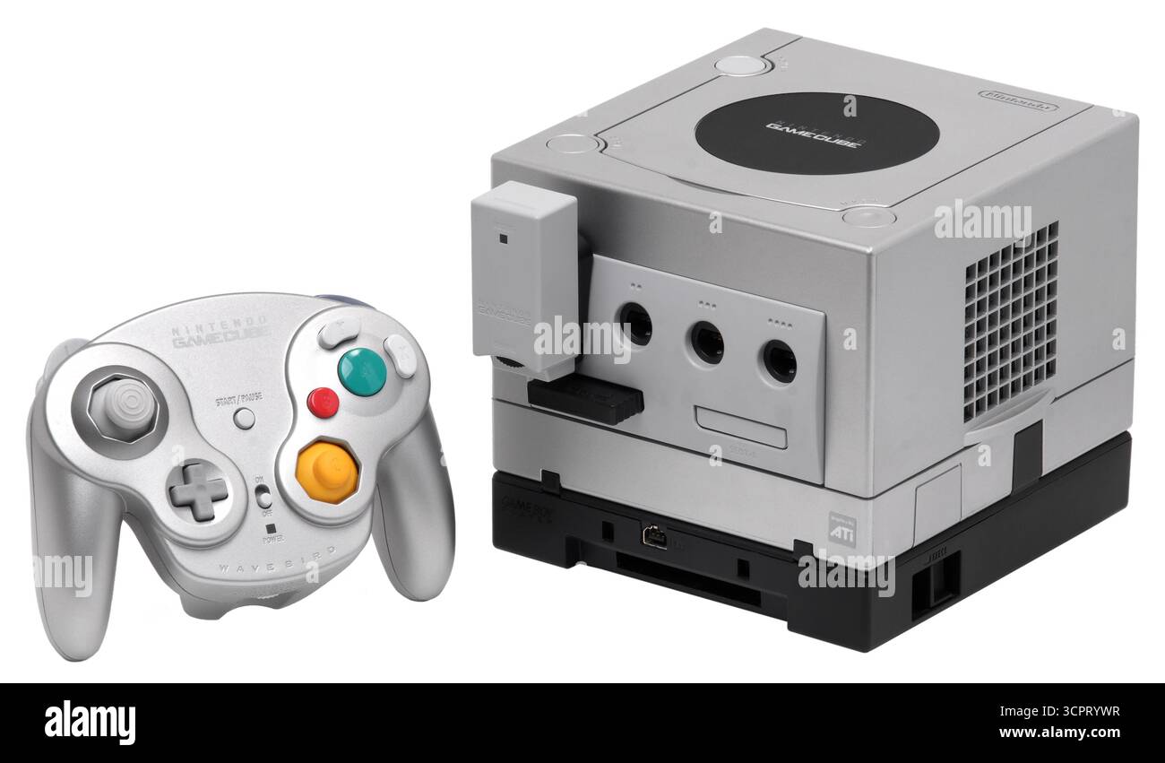 2001 silver Nintendo GameCube console with a silver Wavebird wireless controller and opitional Game Boy Player. Stock Photo