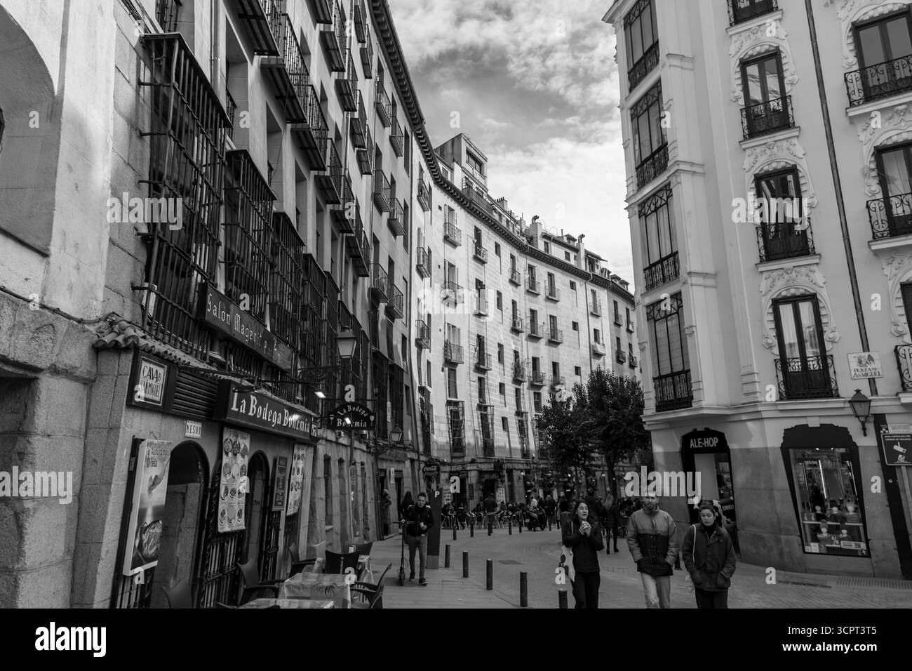 Madrid, Spain - FEB 19, 2022: A vibrant weekend morning on the Calle Cava de San Miguel, a street between the Plaza Mayor and San Miguel food market. Stock Photo
