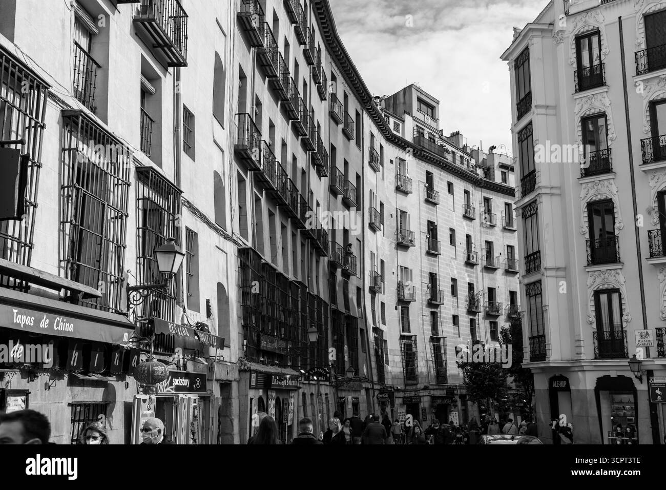 Madrid, Spain - FEB 19, 2022: A vibrant weekend morning on the Calle Cava de San Miguel, a street between the Plaza Mayor and San Miguel food market. Stock Photo