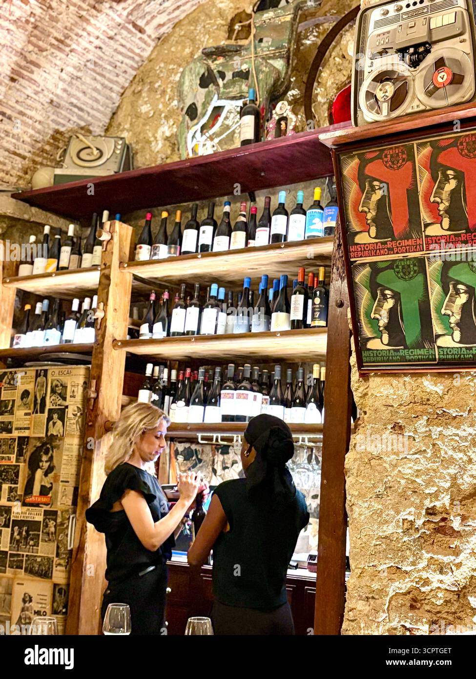 Waitresses talking to each other at the Taberna Anti Dantas restaurant on R. São José 206, Lison, Portugal,Europe - Smartphone Captured Stock Image